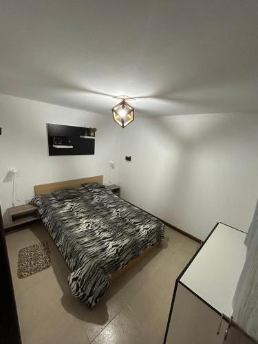 a bedroom with a zebra print bed in a room at El EDEN in Mar de Cobo