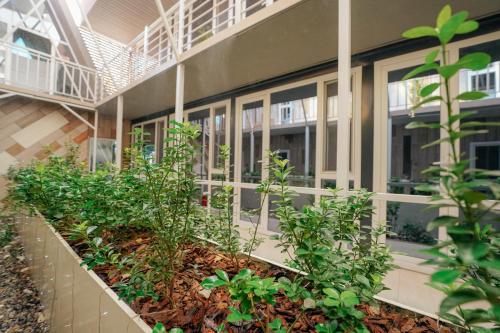 a building with plants on the side of it at ИксаОтель in Shymkent
