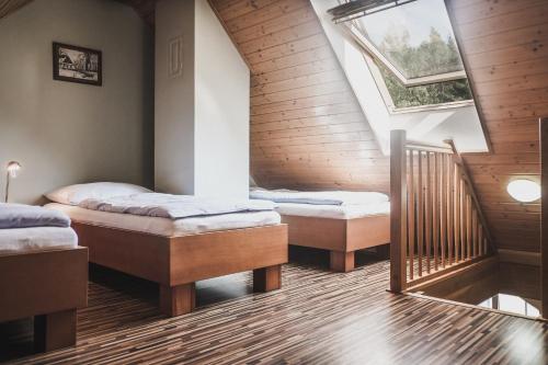 Postel nebo postele na pokoji v ubytování Chata Trojkámen