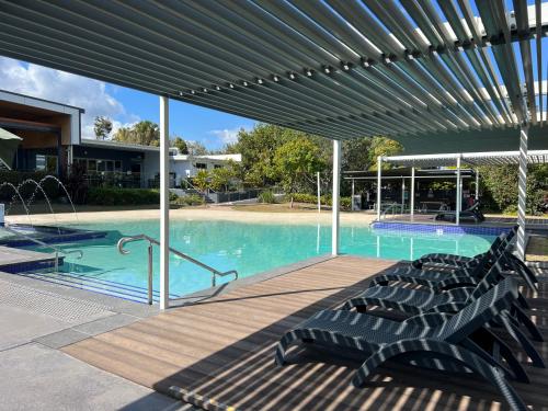 a large swimming pool with a large blue swimming pool at Pet Friendly &Home away From Home & Resort Facility in Rochedale