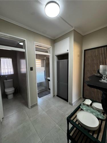 a room with a bathroom with a toilet and a sink at Willow Cottage in Evander