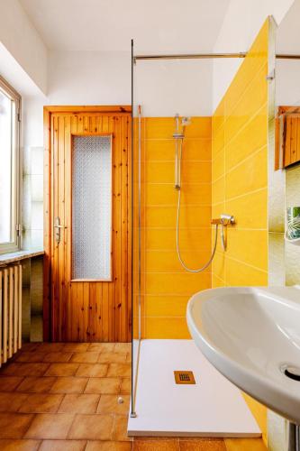 a bathroom with a glass shower and a sink at Ca’ Ruset in Roccaforte Mondovì