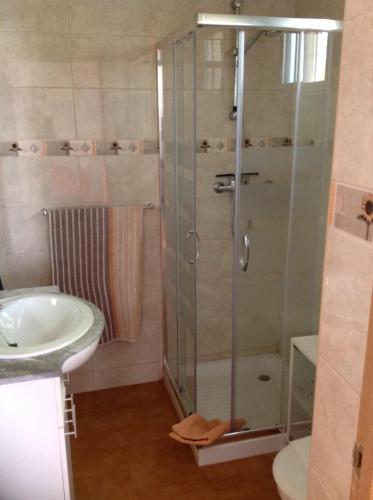 a bathroom with a shower and a sink at Casita Ramona in Valencia