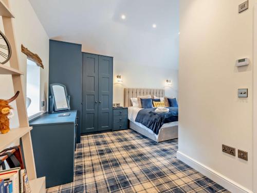 a bedroom with a bed and a tv in it at 1 Bed in Scaleby 94538 in Scaleby