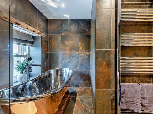 a bathroom with a sink and a mirror at 1 Bed in Scaleby 94538 in Scaleby