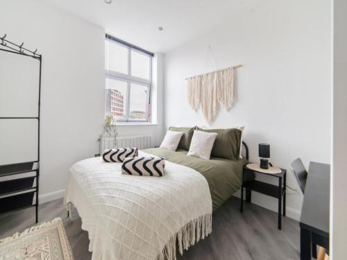 a bedroom with a bed and a window at Opal Residence City Centre in Leicester