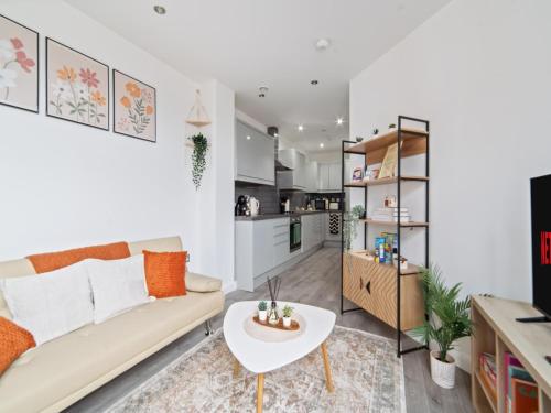 a living room with a couch and a table at Opal Residence City Centre in Leicester