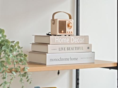 a stack of books with a radio on top at Opal Residence City Centre in Leicester