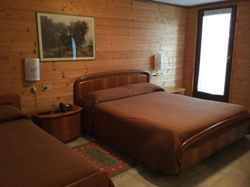 Giường trong phòng chung tại Albergo Ciori