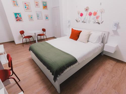 Ένα ή περισσότερα κρεβάτια σε δωμάτιο στο La tana del Furlo