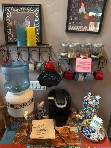 a kitchen counter with a table with a kitchen utensils at Mystic Canyon Inn in El Cajon
