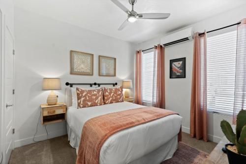a bedroom with a bed and a ceiling fan at New 4 bed 3 and half bath with pool, hot tub, waterslide and PS5 in Saint George Municipal Airport