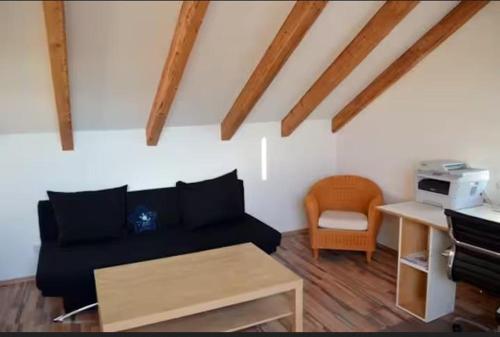a living room with a couch and a table at Delfinia 