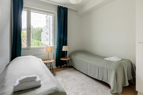 Ένα ή περισσότερα κρεβάτια σε δωμάτιο στο Spacious Apartment for 4 with Sauna