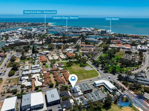an aerial view of a city with the ocean at Mandurah Luxury on Sutton in Mandurah
