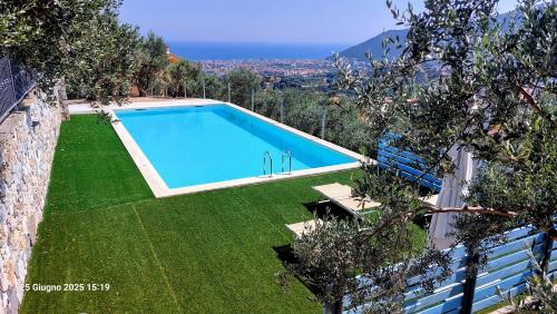 an image of a swimming pool in a yard at Vista Mare in Boissano
