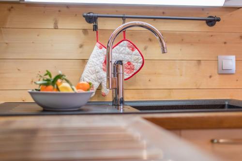 a kitchen counter with a kitchen sink with a kitchen sink at Rdc 110 m2 - Très proche des pistes in La Toussuire
