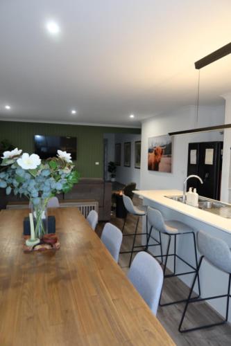 a kitchen with a table and chairs and a counter at The Nagambie Stay in Nagambie