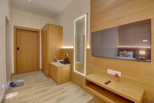 a bathroom with a sink and a mirror at Hotel Warma Palace in Yeola