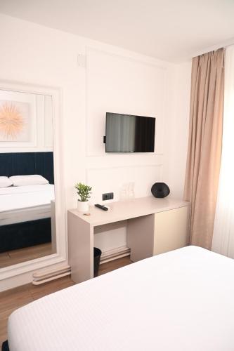 Ένα ή περισσότερα κρεβάτια σε δωμάτιο στο Mas Motel