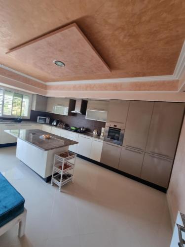 a large kitchen with a large island in the middle at Ferienwohnung Nabeul in Douane