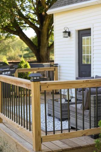 a wooden deck with a fence on a house at The Horse Carriage 2 Miles From Foxwoods Casino in Preston