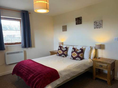 En eller flere senge i et værelse på Roan Cottage