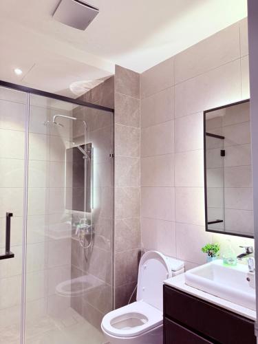 a bathroom with a shower and a toilet and a sink at AXON RESIDENCE BUKIT BINTANG KLCC by FIRST CLASS in Kuala Lumpur