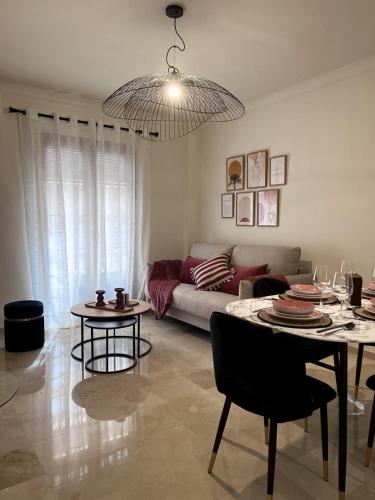 a living room with a couch and a table at Apartamento Boutique Centro Histórico in Antequera