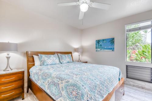 a bedroom with a bed and a ceiling fan at Wailea Grand Champions 87 in Wailea