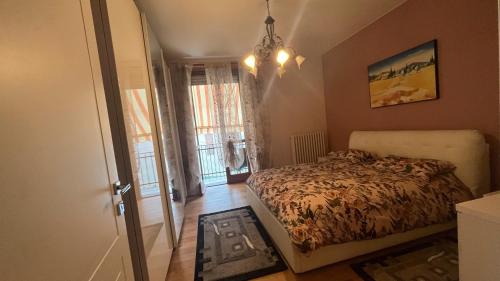 Postel nebo postele na pokoji v ubytování Magnifico Roero Relax Tre Camere