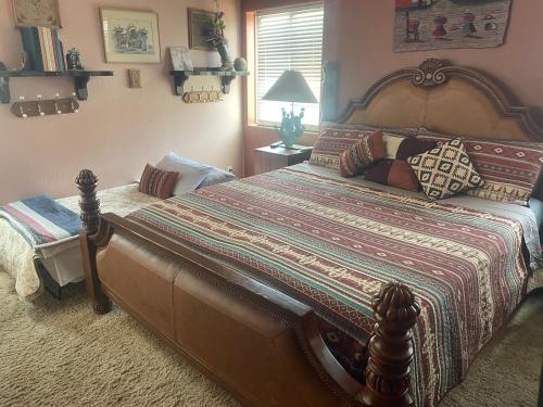a bedroom with a large bed in a room at Mystic Canyon Inn in El Cajon
