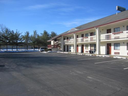 an empty parking lot in front of a hotel at Days Inn by Wyndham Queensbury/Lake George in Queensbury