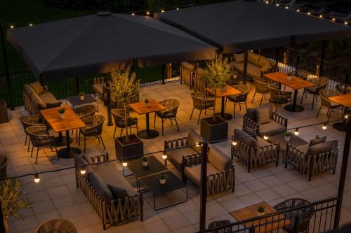 an overhead view of a patio with tables and chairs and lights at Holiday Inn Farnborough by IHG in Farnborough