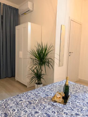 a bottle of wine sitting on a table in a room at Nido Flegreo in Pozzuoli