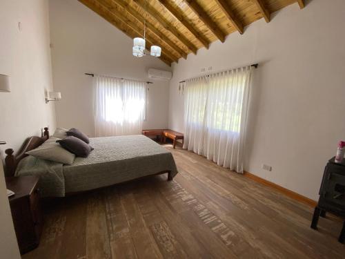 a bedroom with a bed and a wooden floor at Casa en Costa Del Este in Costa del Este