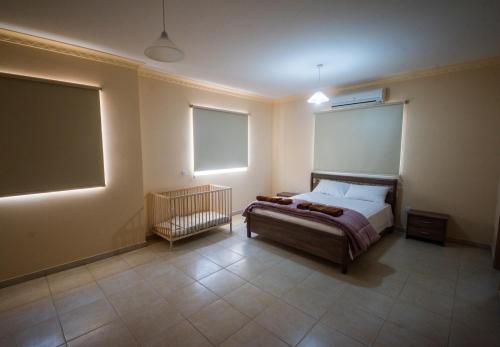 Postel nebo postele na pokoji v ubytování Panais Villa