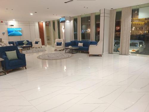 a lobby with couches and chairs in a building at فيلمست ريزدنس ابها للشقق الفندقية Velmist Residence Abha in Abha