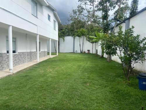 an empty yard next to a white building at Villa Cami in La Mata