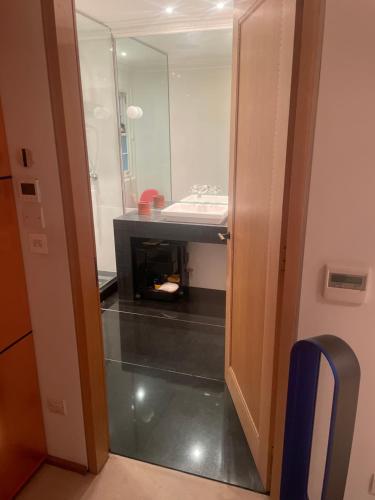 a bathroom with a fireplace and a sink at 1 callcoot Road in London