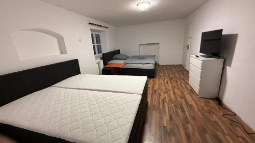 Ένα ή περισσότερα κρεβάτια σε δωμάτιο στο Wohnung für bis zu 6 Personen in 84375 Kirchdorf