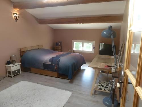 Postel nebo postele na pokoji v ubytování Entre Vignes et Garrigues