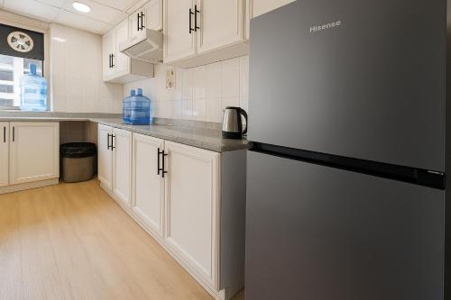 Kuchyň nebo kuchyňský kout v ubytování The Mini Homes Dorm Near Metro station