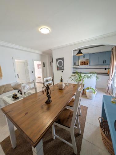 a dining room with a wooden table and chairs at 202 - Livingtarifa Dolce Vita in Tarifa