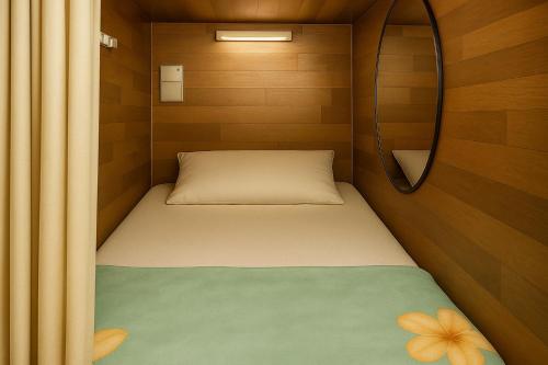 Ένα ή περισσότερα κρεβάτια σε δωμάτιο στο Classic Capsule Bur-dubai Dorm Near Metro