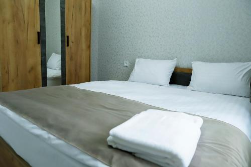 Postel nebo postele na pokoji v ubytování Travel Airport Inn