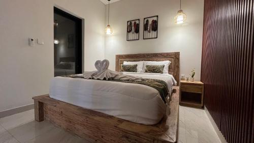 Postel nebo postele na pokoji v ubytování Puspa Private Guest House