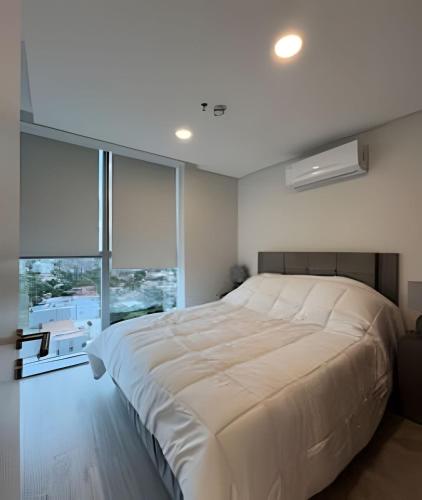 Ένα ή περισσότερα κρεβάτια σε δωμάτιο στο Depto en el eje corporativo