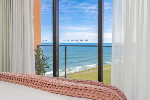 a large window with a view of the ocean at 901 - Perfect Penthouse - With Free Parking in Newcastle