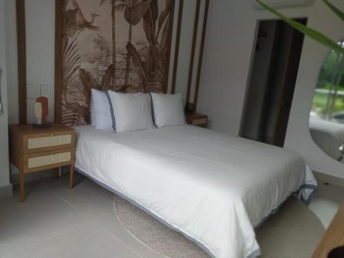 Un ou plusieurs lits dans un hébergement de l'établissement Apto de Ensueño en aguas cristalinas Baía Kristal